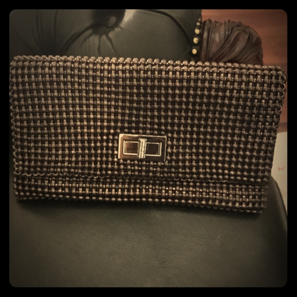 NWOT BCBG clutch. Excellent condition. 10”x6”x1”